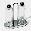 This oil-vinegar cruet by Alessi in polished steel and crystal brings a modern edge to your table.