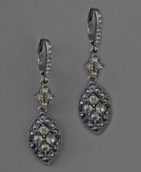 Sultry drop earring by Givenchy with jet stones and black crystal accents set in hematite-plated mixed metal. Approximate drop: 1-1/2 inches. Sultry drop earring by Givenchy with jet stones and black crystal accents set in hematite-plated mixed metal. Approximate drop: 1-1/2 inches.