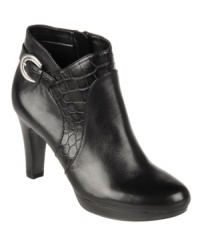 Naturalizer's Illy ankle boots ideally combine comfort with chic design. The round-toe silhouette and just-right heel height make them effortless to wear, while croc embossed accents and a buckle embellishment on the side add panache. Naturalizer's Illy ankle boots ideally combine comfort with chic design. The round-toe silhouette and just-right heel height make them effortless to wear, while croc embossed accents and a buckle embellishment on the side add panache.