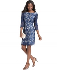 Eliza J's elegant dress features a collarbone-skimming boat neckline and a sophisticated lace overlay with scalloped edges. Eliza J's elegant dress features a collarbone-skimming boat neckline and a sophisticated lace overlay with scalloped edges.