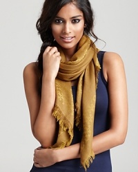 An elegant Tory Burch woven scarf with subtle logo print all over. An elegant Tory Burch woven scarf with subtle logo print all over.