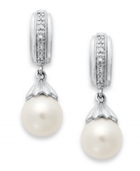 A class act. These elegant earrings feature cultured freshwater pearls (7-7-1/2 mm) with sparkling diamond accents for extra shine. Set in sterling silver. Approximate length: 7/8 inch. Approximate width: 1/4 inch.