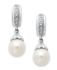 A class act. These elegant earrings feature cultured freshwater pearls (7-7-1/2 mm) with sparkling diamond accents for extra shine. Set in sterling silver. Approximate length: 7/8 inch. Approximate width: 1/4 inch. A class act. These elegant earrings feature cultured freshwater pearls (7-7-1/2 mm) with sparkling diamond accents for extra shine. Set in sterling silver. Approximate length: 7/8 inch. Approximate width: 1/4 inch.