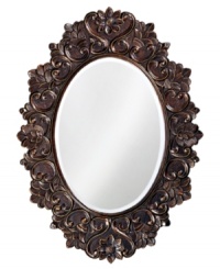 A flourishing spring garden blooms in a blackened copper hue, creating a bold, theatrical ring around the Hamilton mirror. A flourishing spring garden blooms in a blackened copper hue, creating a bold, theatrical ring around the Hamilton mirror.