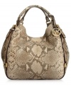 An absolute snake charmer, this posh python-embossed leather tote from MICHAEL Michael Kors is the accessory of the season. Soft leather is adorned with golden buckle and stud accents, while the roomy interior provides three separate compartments to keep you organized on-the-go.