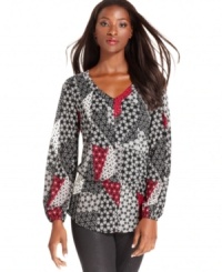 A mixed patchwork print with a touch of red lends this Style&co. top a striking look. A mixed patchwork print with a touch of red lends this Style&co. top a striking look.