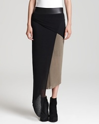 Rock 'n' roll style with sophisticated edge? It arrives with this Helmut Lang skirt decorated with a leather waistband and asymmetric draping-a true representation of your inner edge. Rock 'n' roll style with sophisticated edge? It arrives with this Helmut Lang skirt decorated with a leather waistband and asymmetric draping-a true representation of your inner edge.