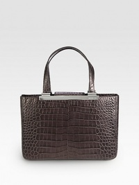Luxurious crocodile embossed leather in a classic, structured shape with sleek hardware.Double top handles, 7½ dropMagnetic snap strap closureProtective metal feetThree inner compartmentsTwo inside zip pocketsFour inside open pocketsFully lined13½W X 9H X 4½DImported Luxurious crocodile embossed leather in a classic, structured shape with sleek hardware.Double top handles, 7½ dropMagnetic snap strap closureProtective metal feetThree inner compartmentsTwo inside zip pocketsFour inside open pocketsFully lined13½W X 9H X 4½DImported
