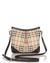 Go preppy chic with this checked crossbody bag from Burberry.