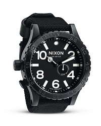 Solid and hard-wearing, this brushed stainless steel watch from Nixon perfectly fuses performance and style. Designed for an athletic lifestyle, it flaunts a flexible nylon band, rotating bezel, and extreme water resistance. Solid and hard-wearing, this brushed stainless steel watch from Nixon perfectly fuses performance and style. Designed for an athletic lifestyle, it flaunts a flexible nylon band, rotating bezel, and extreme water resistance.