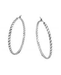 Get all tied up in traditional style with a modern twist. BCBGeneration adds a little extra flair to the classic hoop earring with a unique rope pattern. Crafted in oxidized silver tone mixed metal. Approximate diameter: 1-1/2 inches. Get all tied up in traditional style with a modern twist. BCBGeneration adds a little extra flair to the classic hoop earring with a unique rope pattern. Crafted in oxidized silver tone mixed metal. Approximate diameter: 1-1/2 inches.