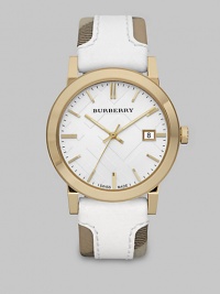 An iconic check strap with a supple leather overlay and a goldtone stainless steel case. Swiss quartz movementWater resistant to 5 ATMRound goldtone stainless steel case, 38mm (1.5)Smooth bezelWhite check stamped dialBar hour markersDate display at 3 o'clockSecond hand White leather accented haymarket check strapMade in Switzerland An iconic check strap with a supple leather overlay and a goldtone stainless steel case. Swiss quartz movementWater resistant to 5 ATMRound goldtone stainless steel case, 38mm (1.5)Smooth bezelWhite check stamped dialBar hour markersDate display at 3 o'clockSecond hand White leather accented haymarket check strapMade in Switzerland