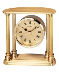 Add stately charm to any tabletop with this refined desk clock from Seiko. Goldtone solid brass four-column frame and floating round case. Round goldtone dial with logo and roman numeral indices. Battery included. Measures approximately 5-1/2 x 5-1/2 x 2. Add stately charm to any tabletop with this refined desk clock from Seiko. Goldtone solid brass four-column frame and floating round case. Round goldtone dial with logo and roman numeral indices. Battery included. Measures approximately 5-1/2 x 5-1/2 x 2.