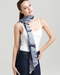 A sheer oblong scarf featuring a gorgeous tropical flora print and signature logo at hem. A sheer oblong scarf featuring a gorgeous tropical flora print and signature logo at hem.