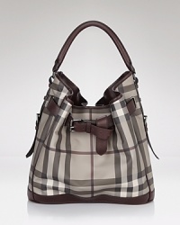 Paired with your workday LBD or weekend denim, Burberry's belted hobo exudes effortless chic. Paired with your workday LBD or weekend denim, Burberry's belted hobo exudes effortless chic.