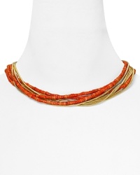 Let MICHAEL Michael Kors lend every look a colorful touch with this beaded coral and gold tone bib necklace. It's bold layered look instantly enlivens your neckline. Let MICHAEL Michael Kors lend every look a colorful touch with this beaded coral and gold tone bib necklace. It's bold layered look instantly enlivens your neckline.