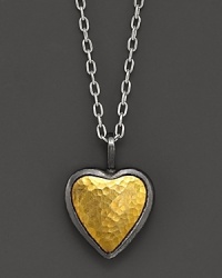 A hammered 24K yellow gold and sterling silver heart makes a romantic, modern statement. A hammered 24K yellow gold and sterling silver heart makes a romantic, modern statement.