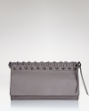 Toughen up your after-hours line up with Oryany's braided leather clutch. In a crave-worthy shape and pared-down palette, this bag loves your darkest dresses and boots.
