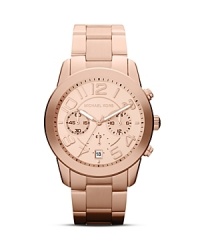 Get it right office or off duty with this handsome Michael Kors watch, which crafts a sophisticated statement with its rose gold plated dial and matching link bracelet. Get it right office or off duty with this handsome Michael Kors watch, which crafts a sophisticated statement with its rose gold plated dial and matching link bracelet.