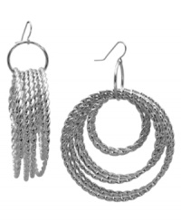 Put a ring on it. These twisted hoop earrings from GUESS feature multiple rings of differing sizes. Crafted in imitation rhodium-plated mixed metal. Approximate drop: 2-1/2 inches. Approximate diameter: 2 inches. Put a ring on it. These twisted hoop earrings from GUESS feature multiple rings of differing sizes. Crafted in imitation rhodium-plated mixed metal. Approximate drop: 2-1/2 inches. Approximate diameter: 2 inches.