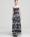 Capture attention in this strapless floral dress from BCBGMAXAZRIA. Thin tiers of printed fabric cascade down the body for a striking effect.