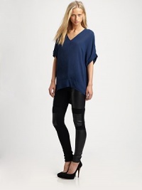 Featherweight crepe in a sexy v-neck tunic that hangs just-so off the body.V-neckDropped shouldersCuffed sleevesContour hemBack gathered below yokeRayonDry cleanImportedModel shown is 5'8½ (174cm) wearing US size Small. Featherweight crepe in a sexy v-neck tunic that hangs just-so off the body.V-neckDropped shouldersCuffed sleevesContour hemBack gathered below yokeRayonDry cleanImportedModel shown is 5'8½ (174cm) wearing US size Small.