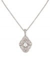 Classic elegance. This necklace from Carolee is crafted from silver-tone mixed metal with a pendant prominently featuring a glass pearl adorned by glass stones for a lustrous touch. Approximate length: 17 inches. Approximate drop: 1/8 inch.