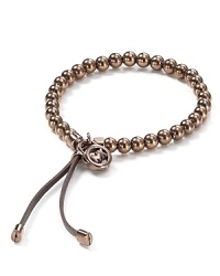 Bring luxe shine to your looks with this beaded bracelet finished with leather accents from Michael Kors. Bring luxe shine to your looks with this beaded bracelet finished with leather accents from Michael Kors.