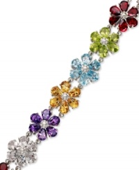 Petal perfection. Crafted in sterling silver, petite flowers adorn this pretty bracelet. Crafted in sterling silver with pear-cut blue topaz (6 ct. t.w.), citrine (4-1/3 ct. t.w.), garnet (6 ct. t.w.), amethyst (6-1/2 ct. t.w.), peridot (5-1/4 ct. t.w.) and white topaz (6 ct. t.w.). Approximate length: 7-1/2 inches. Petal perfection. Crafted in sterling silver, petite flowers adorn this pretty bracelet. Crafted in sterling silver with pear-cut blue topaz (6 ct. t.w.), citrine (4-1/3 ct. t.w.), garnet (6 ct. t.w.), amethyst (6-1/2 ct. t.w.), peridot (5-1/4 ct. t.w.) and white topaz (6 ct. t.w.). Approximate length: 7-1/2 inches.