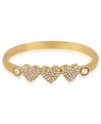 Your heart will go aflutter for this hinge bangle bracelet from Betsey Johnson. A triple heart design is prettied up with crystal accents. Includes signature gift box (4 diameter). Crafted in antique gold tone mixed metal. Approximate diameter: 2-1/3 inches. Your heart will go aflutter for this hinge bangle bracelet from Betsey Johnson. A triple heart design is prettied up with crystal accents. Includes signature gift box (4 diameter). Crafted in antique gold tone mixed metal. Approximate diameter: 2-1/3 inches.