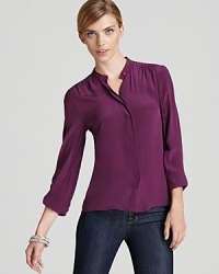 Rendered in luxe silk with gathering at the shoulders, this Tegan top updates your wardrobe with sophisticated workday style. Rendered in luxe silk with gathering at the shoulders, this Tegan top updates your wardrobe with sophisticated workday style.