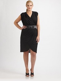 A glamorous faux-wrap design with a waist-accentuating belt and an oh-so-chic tulip skirt.V-necklineSleevelessEmbellished, back-tie beltTulip skirtAbout 17 from natural waistRayonDry cleanMade in USA of imported fabric A glamorous faux-wrap design with a waist-accentuating belt and an oh-so-chic tulip skirt.V-necklineSleevelessEmbellished, back-tie beltTulip skirtAbout 17 from natural waistRayonDry cleanMade in USA of imported fabric
