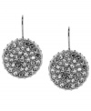 Filled with shimmering intrigue, these Vince Camuto earrings feature crystal pave stones on drop discs. Crafted in rhodium-plated mixed metal. Approximate drop: 1-1/4 inches.