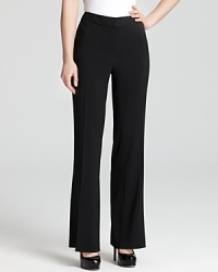 The cornerstone of any working wardrobe, these T Tahari pants combine clean styling with precise tailoring for a flattering silhouette. Pair with polished pumps and command a strong stance. The cornerstone of any working wardrobe, these T Tahari pants combine clean styling with precise tailoring for a flattering silhouette. Pair with polished pumps and command a strong stance.