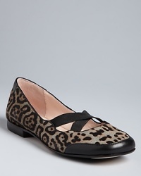 Elastic criss-cross straps make these shoes as secure as they are stylish, in an exotic leopard print. Orthopedic-surgeon-turned-designer Taryn Rose's signature soles make these flats fantastically comfortable as well: Run wild. Elastic criss-cross straps make these shoes as secure as they are stylish, in an exotic leopard print. Orthopedic-surgeon-turned-designer Taryn Rose's signature soles make these flats fantastically comfortable as well: Run wild.