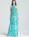 From the vibrant abstract print to the floor-sweeping silk, this Shoshanna maxi dress masters summer chic with effortless elegance.