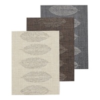 A tonal leaf silhouette brings a touch of nature to your table in this textured placemat. A tonal leaf silhouette brings a touch of nature to your table in this textured placemat.