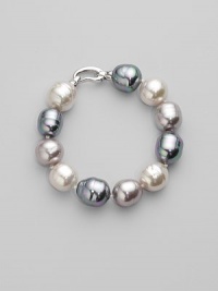 A stunning bracelet of baroque pearls in a palette of whisper soft pastels. 14mm white, grey and nuage man-made organic pearls Length, about 8 Rhodium-plated sterling silver spring clip clasp Made in Spain A stunning bracelet of baroque pearls in a palette of whisper soft pastels. 14mm white, grey and nuage man-made organic pearls Length, about 8 Rhodium-plated sterling silver spring clip clasp Made in Spain