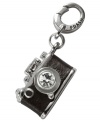 Picture this. Fossil's camera charm, crafted from silver-tone mixed metal and chocolate brown leather, features glass crystal details to capture the moment. Approximate length (charm): 7/8 inch; (clip): 1/2 inch.