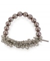 Two halves make quite the whole. Kenneth Cole New York's half stretch bracelet is crafted from silver-tone mixed metal, with taupe glass pearls and beads boosting the style factor. Item comes packaged in a signature Kenneth Cole New York Gift Box. Approximate length: 7-1/2 inches. Approximate width: 5/8 inch.
