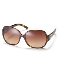 Chic oversized glasses with signature logo embellishment at temples from Tory Burch. Chic oversized glasses with signature logo embellishment at temples from Tory Burch.