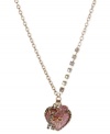 Make a heartfelt statement with this pendant from Betsey Johnson. Crafted from antique gold-tone mixed metal, the necklace shines bright with glass crystal accents, and the glittery heart pendant only adds to the lustrous effect. Item comes packaged in a signature Betsey Johnson Gift Box. Approximate length: 16 inches + 3-inch extender. Approximate drop: 1-3/4 inches.