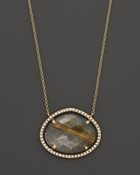 Diamonds circle a faceted rutilated quartz and smoky labradorite doublet set in 18K yellow gold. By Di Massima. Diamonds circle a faceted rutilated quartz and smoky labradorite doublet set in 18K yellow gold. By Di Massima.