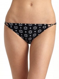 Stylish ikat pattern highlights this classic shape updated with silvertone beads and rings.Interlaced strings with bead and ring accents at sides Fully lined 87% nylon/13% spandex Fully lined Hand wash ImportedPlease note: Bikini top sold separately. Stylish ikat pattern highlights this classic shape updated with silvertone beads and rings.Interlaced strings with bead and ring accents at sides Fully lined 87% nylon/13% spandex Fully lined Hand wash ImportedPlease note: Bikini top sold separately.