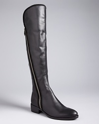 Basic gets interesting in these Donald J Pliner tall boots. A clean silhouette is set off with subtle suede piping and finished off with zippers at each side. Basic gets interesting in these Donald J Pliner tall boots. A clean silhouette is set off with subtle suede piping and finished off with zippers at each side.