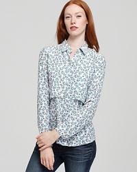 An enchanting floral print enlivens this fresh button-down Theory shirt, rendered in pure silk. An enchanting floral print enlivens this fresh button-down Theory shirt, rendered in pure silk.