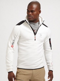 Constructed in a breathable stretch fleece, a half-zip mockneck jacket makes a sporty statement with woven patches and printed logo graphics.Half-zip frontStand collarZippered pocket at sleeve53% polyester/38% nylon/9% elastaneMachine washImported Constructed in a breathable stretch fleece, a half-zip mockneck jacket makes a sporty statement with woven patches and printed logo graphics.Half-zip frontStand collarZippered pocket at sleeve53% polyester/38% nylon/9% elastaneMachine washImported