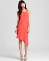 Cut from luxe silk, this brightly hued Kain Label dress flaunts an asymmetrical hem for hyper-modern style.