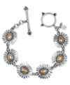 Style in full-bloom from Lucky Brand. This chic toggle bracelet includes floral charms with gold tone accents. Set in silver tone mixed metal. Approximate length: 7-5/8 inches.