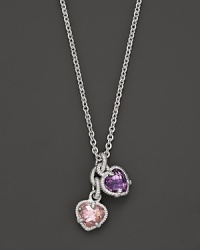 A twin heart necklace in pink crystal and amethyst framed in sterling silver. Designed by Judith Ripka.